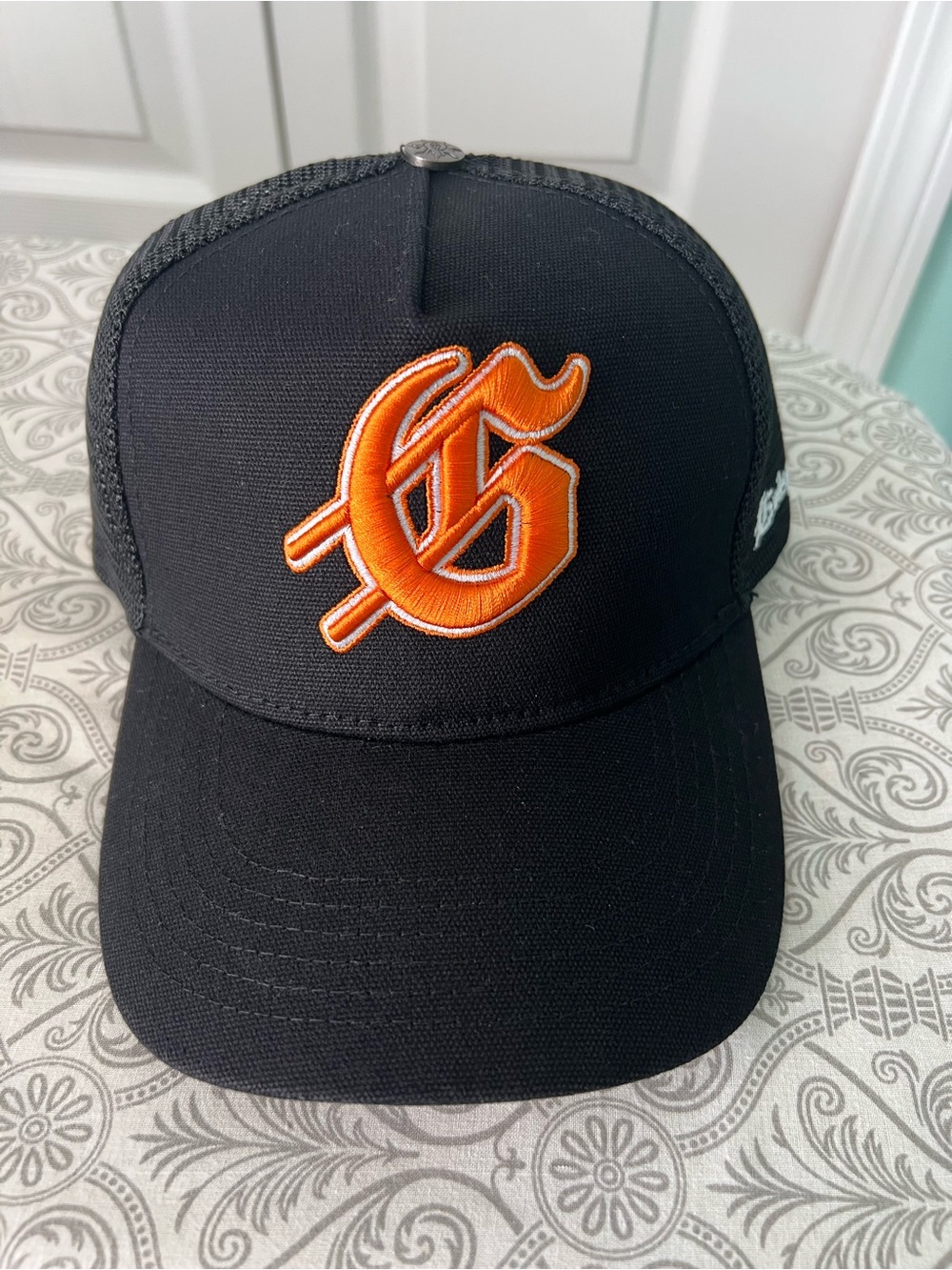 Godspeed New Era Black Trucker Cap with Orange Embroidered Logo